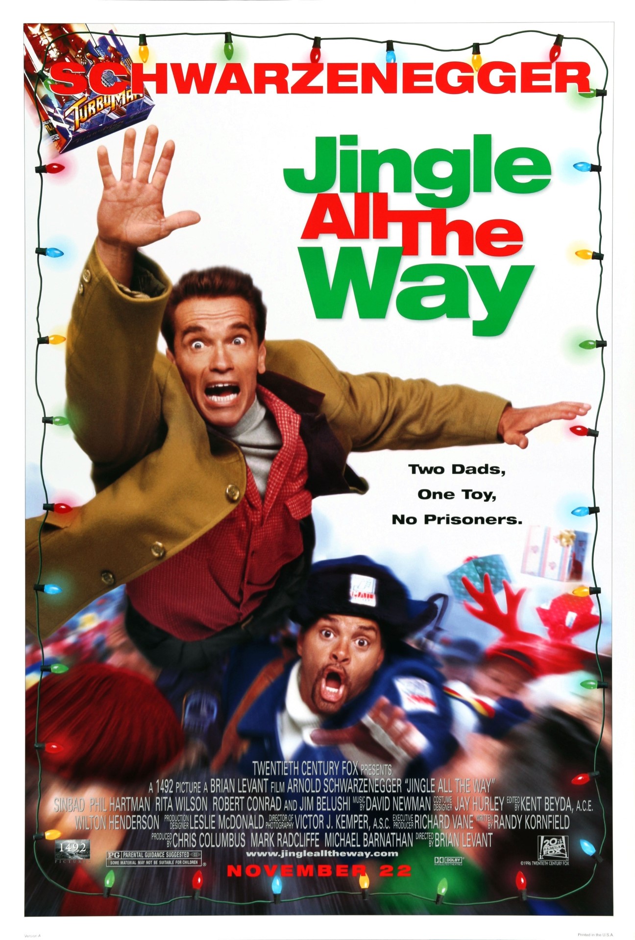A movie poster of Jingle All The Way. Starring Sinbad, Jim Belushi, Robert Conrad, Phil Hartman, Arnold Schwarzenegger, Rita Wilson. Release date 21 11 1996.